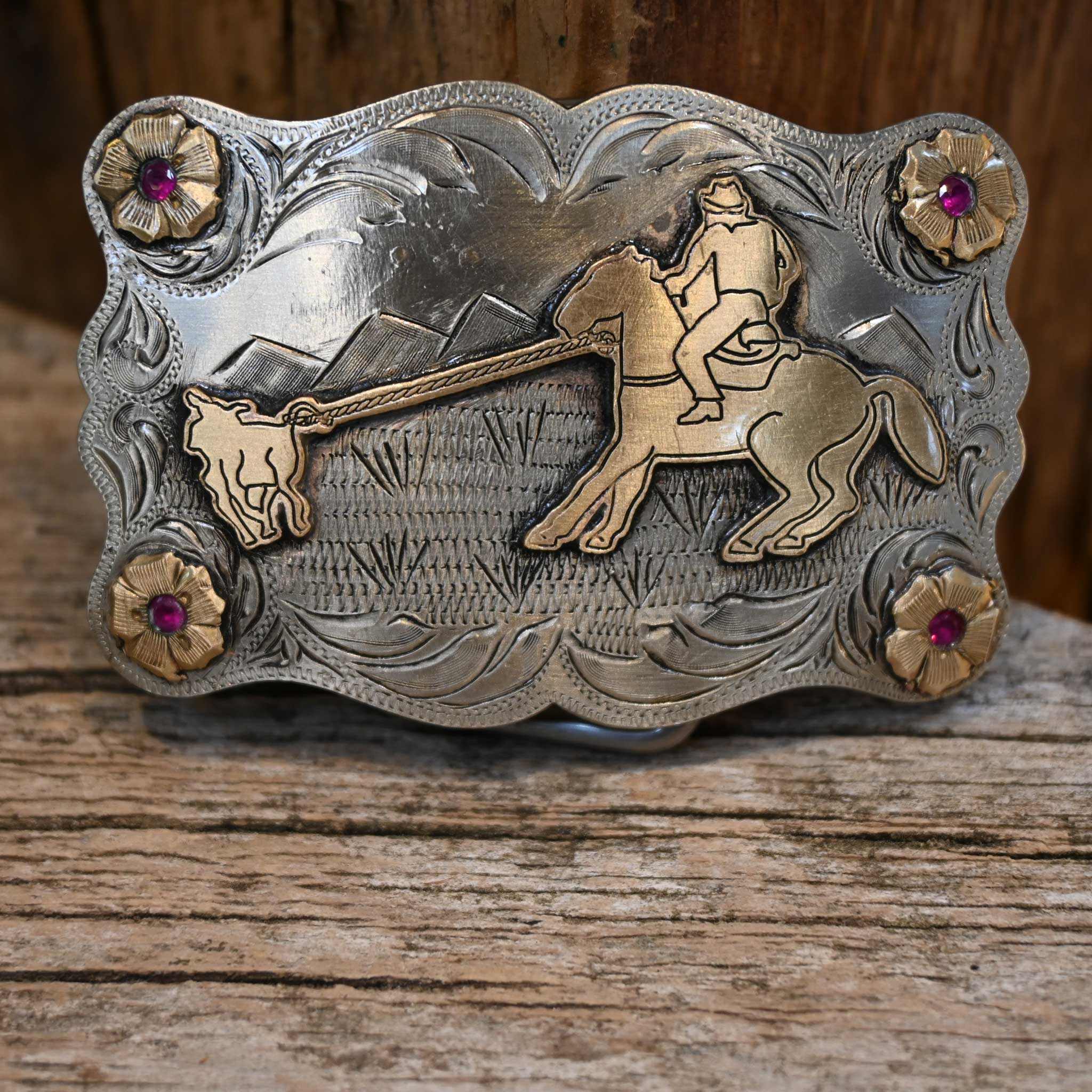 Teskey's Calf Roper Buckle with Red Stones